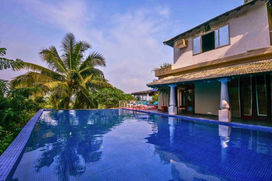 Stunning private pool villa in Goa with an infinity edge and tropical views.