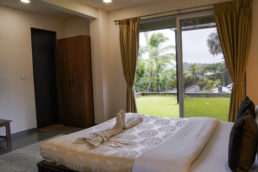 Homestay in Nashik bedroom with garden view and cozy comfort for nature lovers
