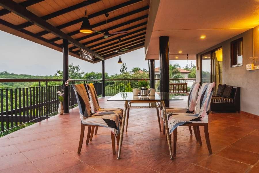 Modern open-plan interior of villas in Nashik with staircase and views.