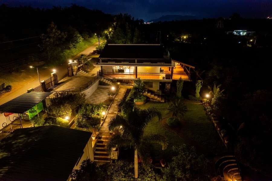 Grand exterior of a Luxury Villa Stay in Nashik, set amidst lush landscapes.