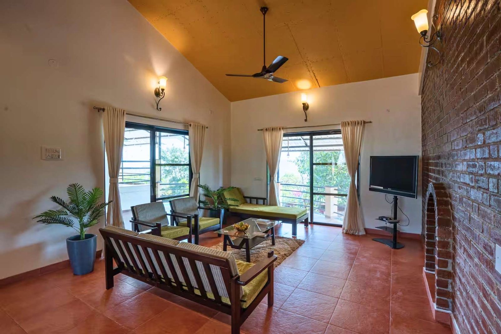 Spacious living room in 4 BHK villa in Panchgani, with traditional and modern feel.