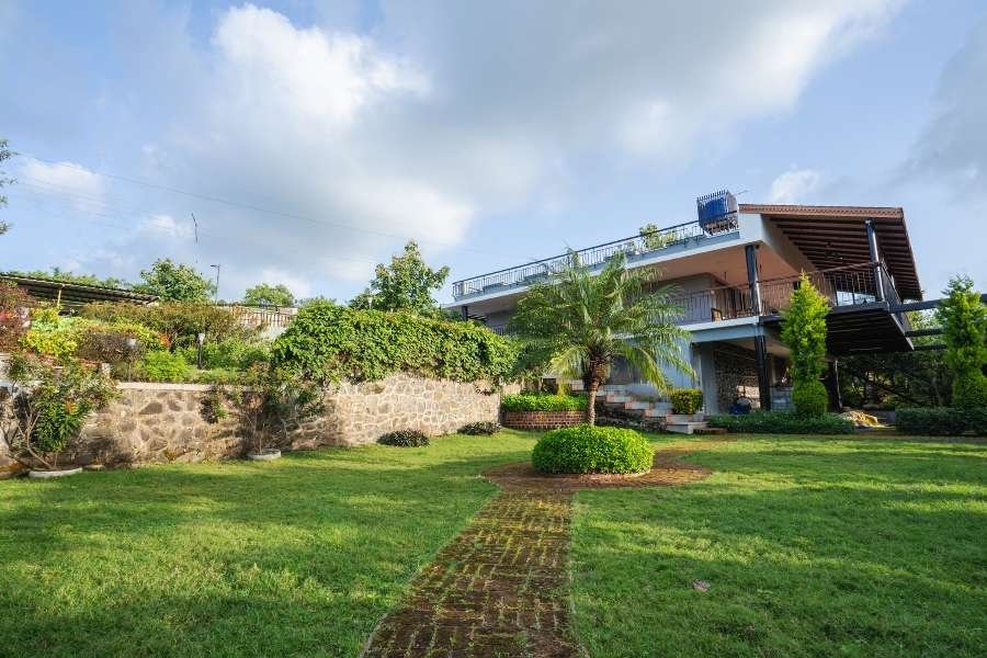 Grand villa property in Nashik for a luxurious stay, surrounded by nature.